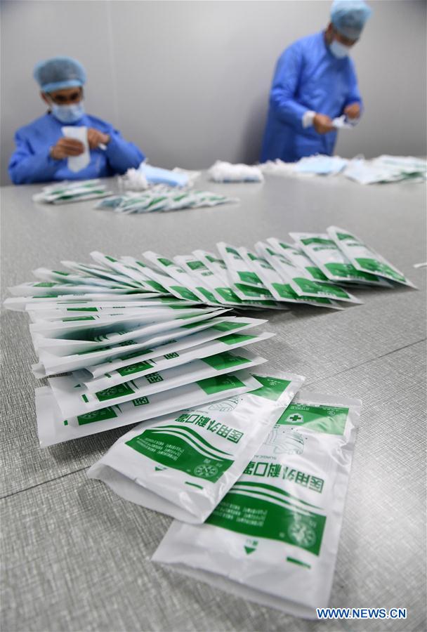CHINA-GUANGXI-NANNING-NUEVO CORONAVIRUS-MASCARILLAS-PRODUCCION