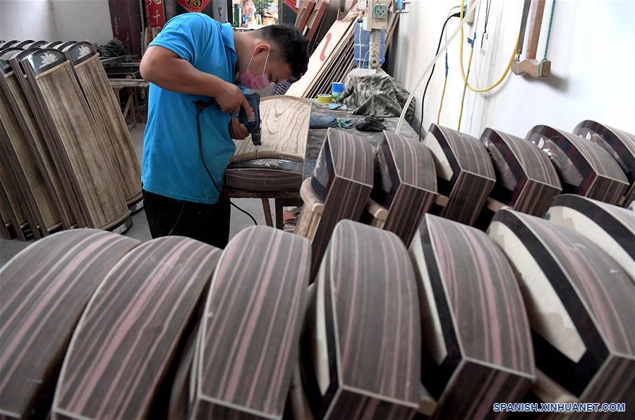 CHINA-HENAN-DESARROLLO-PRODUCCION DE INSTRUMENTOS MUSICALES