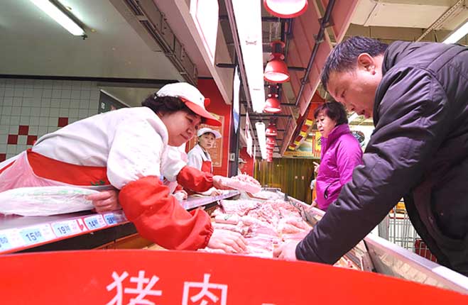 Planificador económico de China minimiza temor de inflación de carne de cerdo