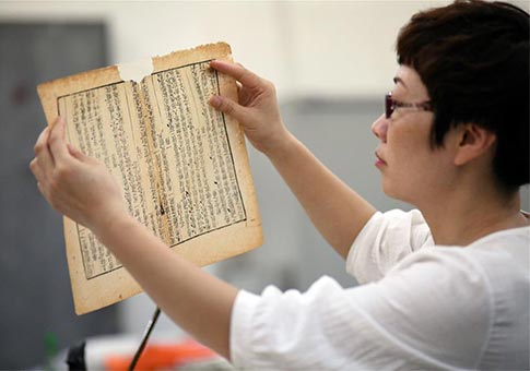 Gao Huiyun ha restaurado más de 1,000 libros antiguos en su carrera de 13 años